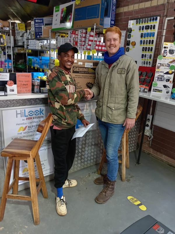 Customer with Gemini gate motor at store